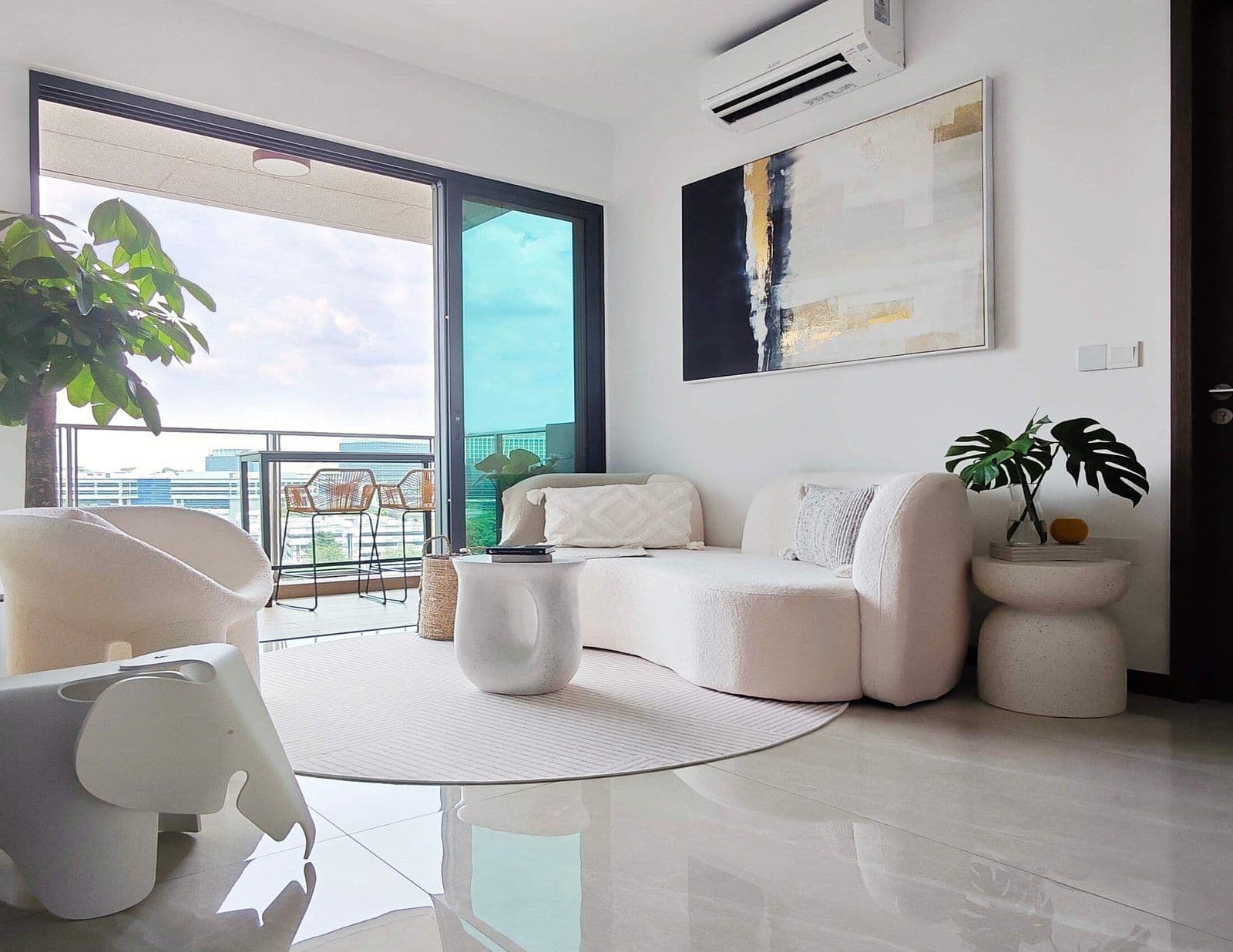 A bright living room opening onto a balcony